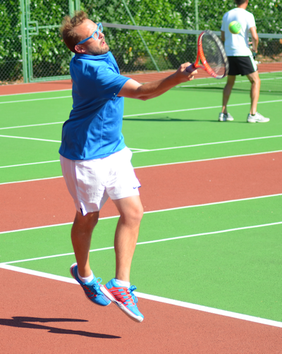 Bill Ingram playing tennis at local club, sport